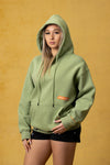 FBL. Sudadera con capucha verde matcha para mujer