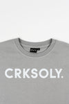 CRKSOLY. Top corto gris para mujer